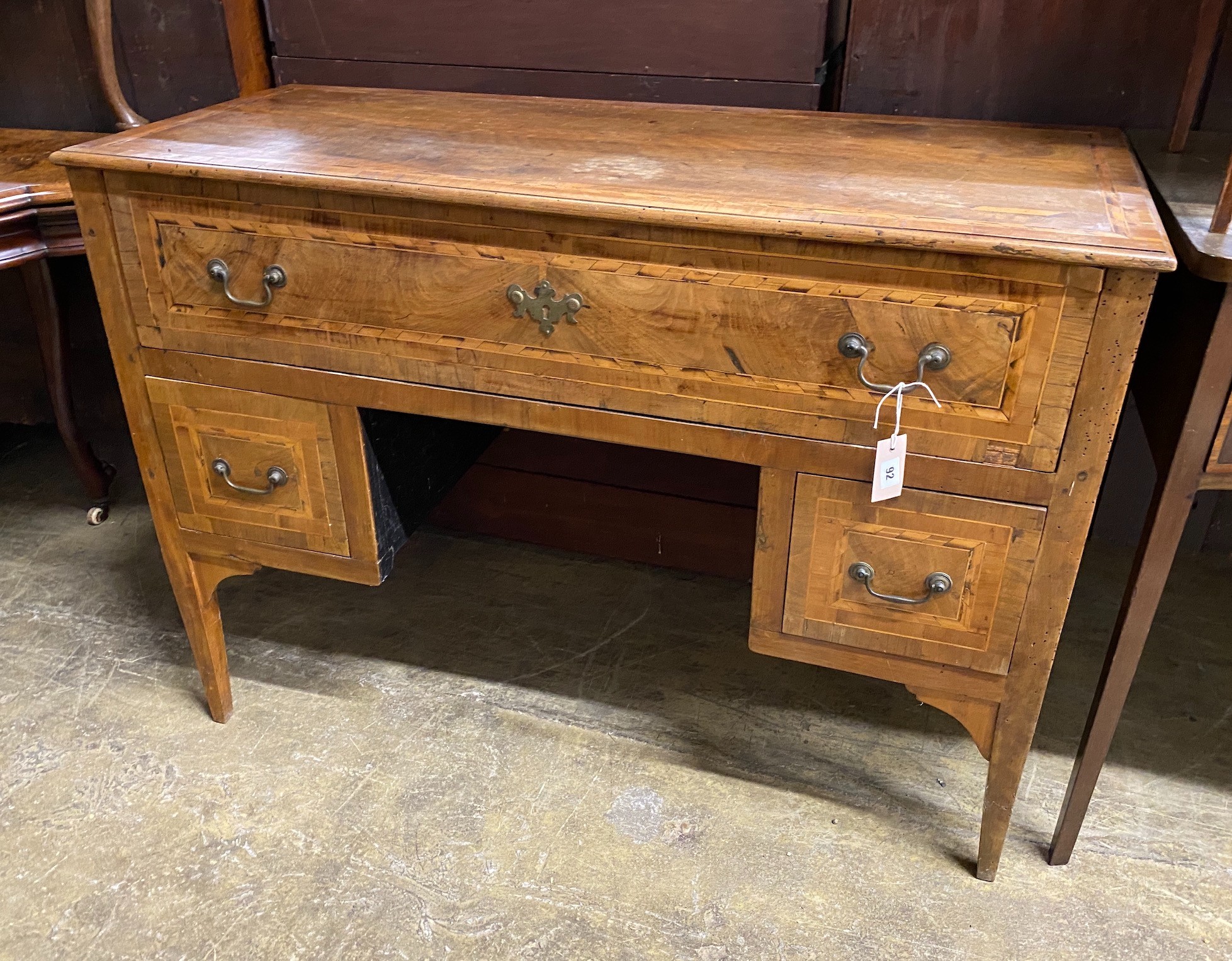 An 18th century Italian walnut kneehole dressing table, width 118cm, depth 49cm, height 85cm